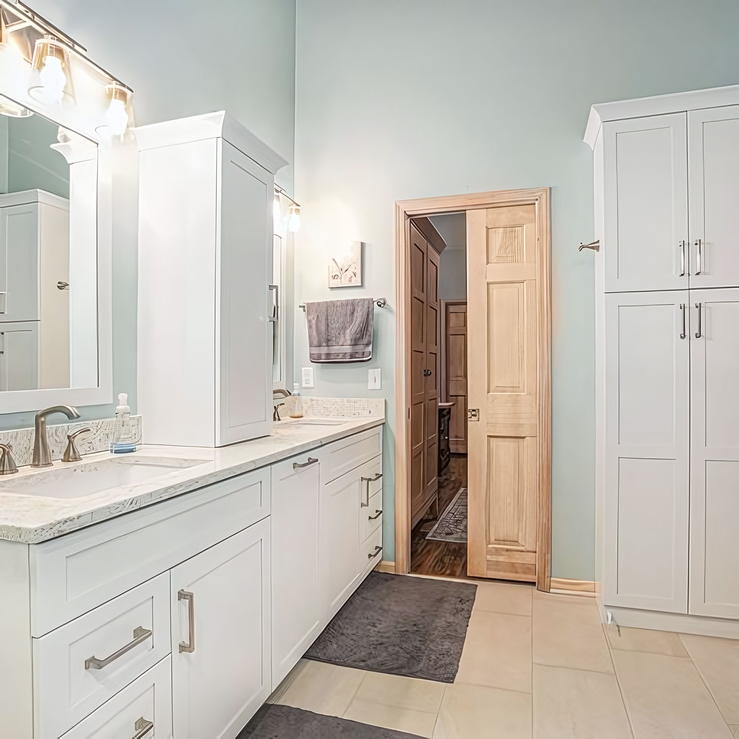 New Bathroom Design and Entrance showing dual vanities and tall storage cabinet