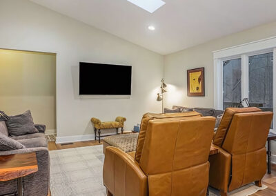 Family Room and Seating area with large chairs and additional seating in view of television