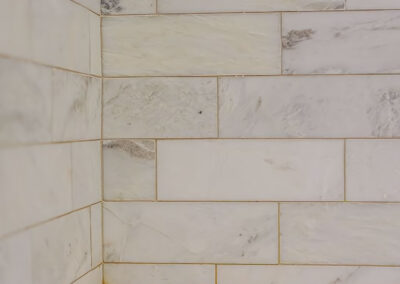 New textured Bath Tile on wall of shower area