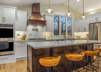 New Beautiful Kitchen Design and Lighting above new island with stools in foreground