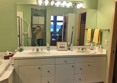 Before Bathroom Redesign, showing old sink and vanity area with large mirror