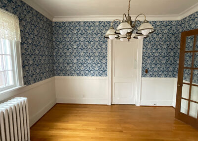 View of old kitchen area with old wallpaper