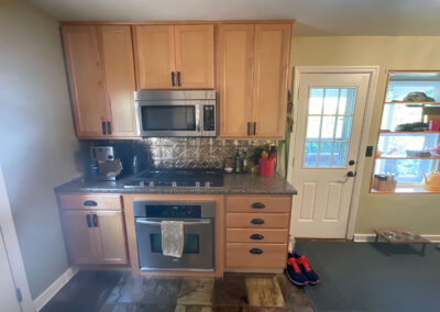 Pontiac Kitchen Before 2 - Countertops, microwave, oven, cabintents